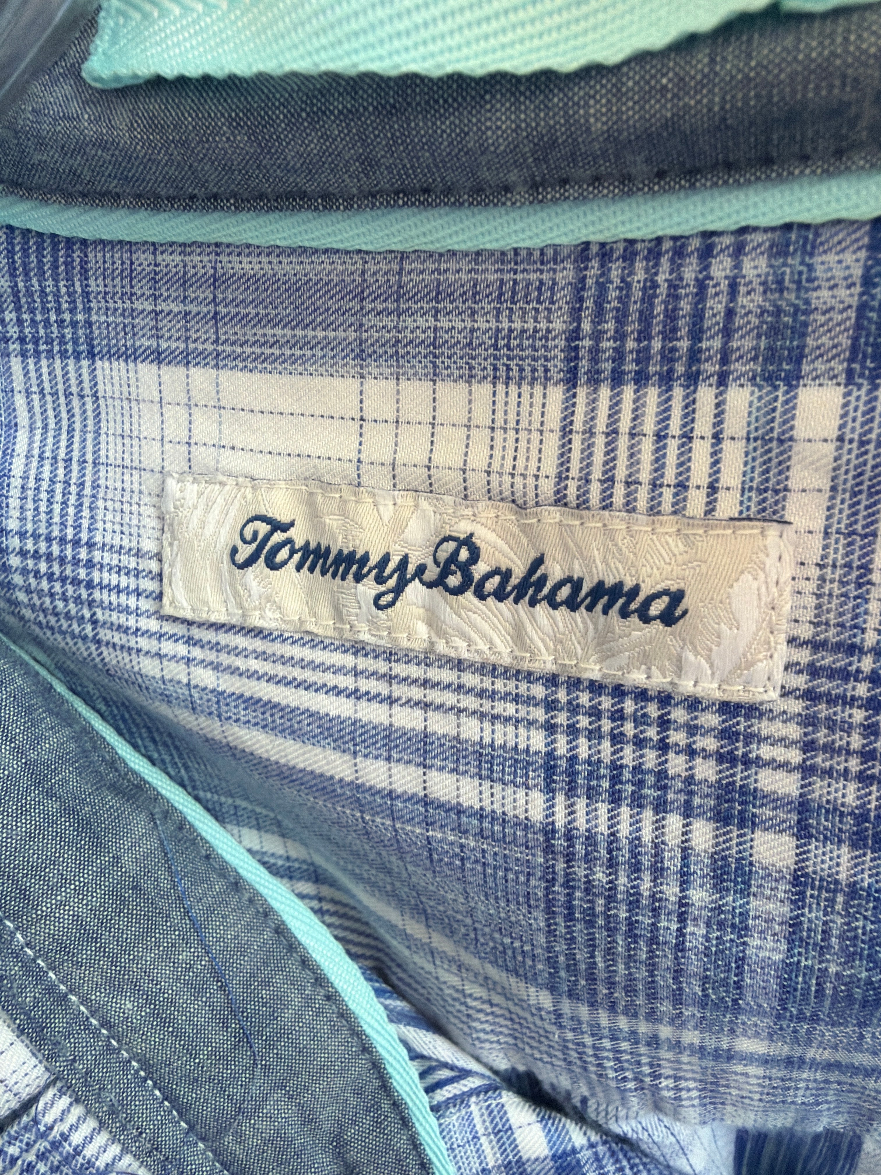 Reworked blue and white plaid button-down with a pleated ruffle collar, a one of a kind upcycled piece from Dover Grace Boutique in Watkinsville, Georgia.