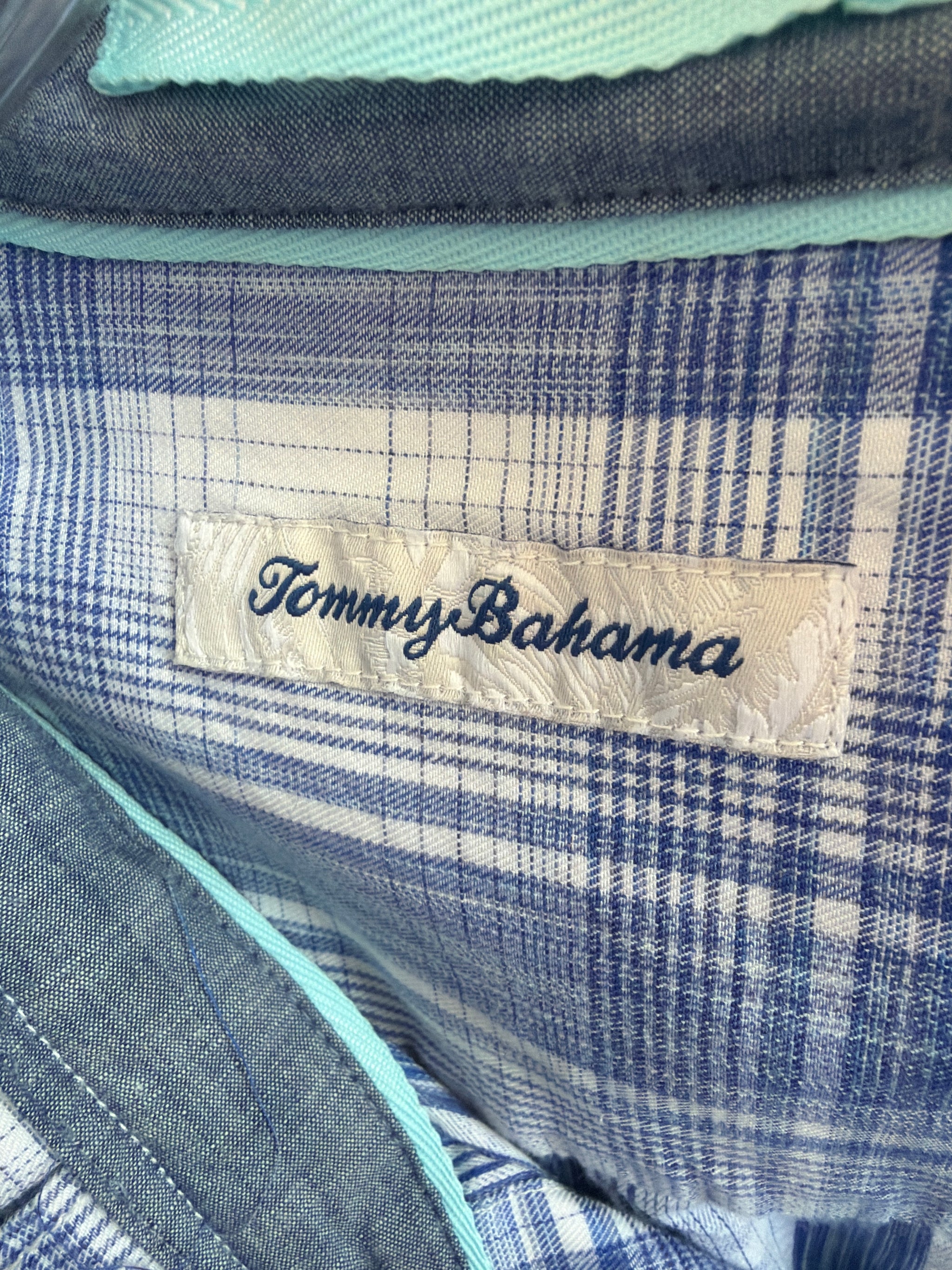 Reworked blue and white plaid button-down with a pleated ruffle collar, a one of a kind upcycled piece from Dover Grace Boutique in Watkinsville, Georgia.