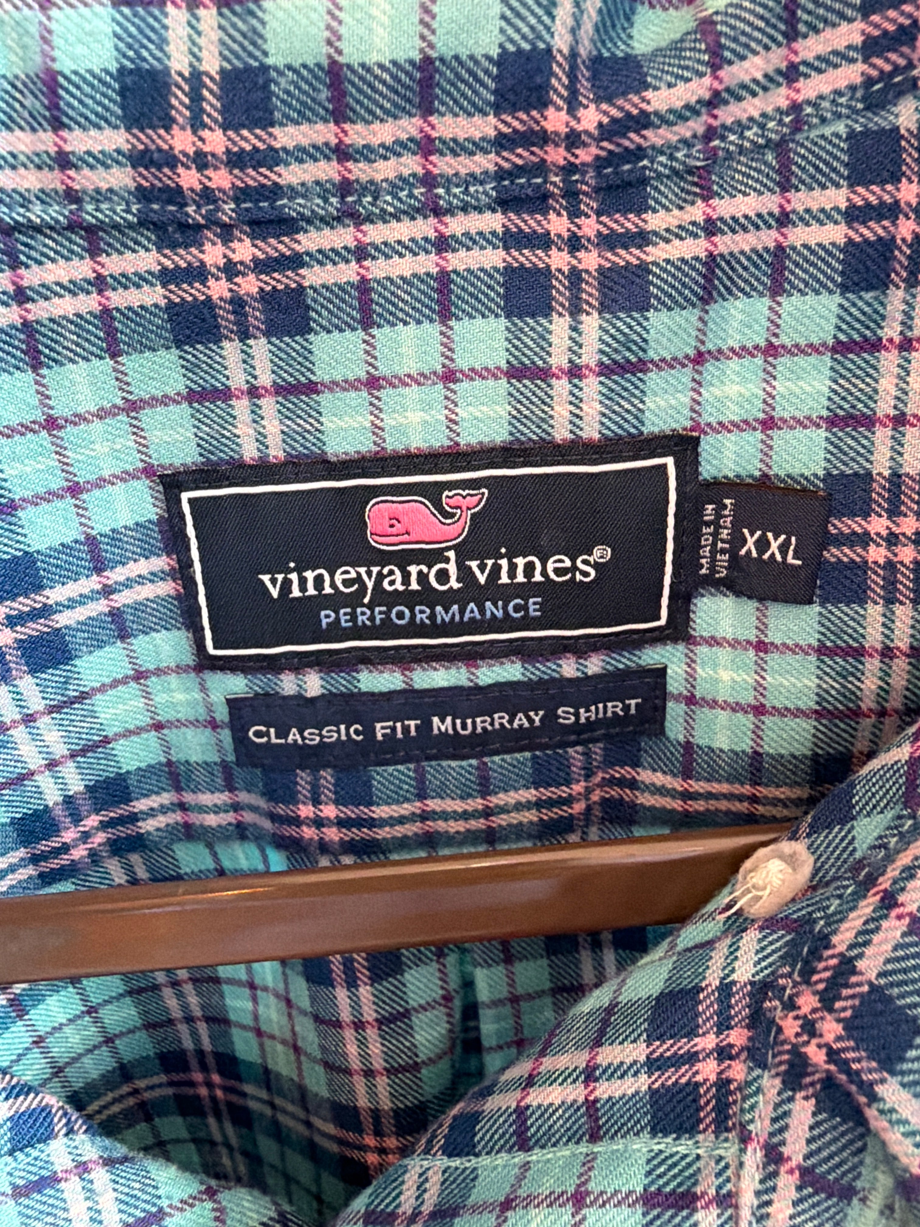 Upcycled blue plaid shirt with a ruffled collar, reworked one of a kind, at Dover Grace Boutique in Watkinsville, Georgia.