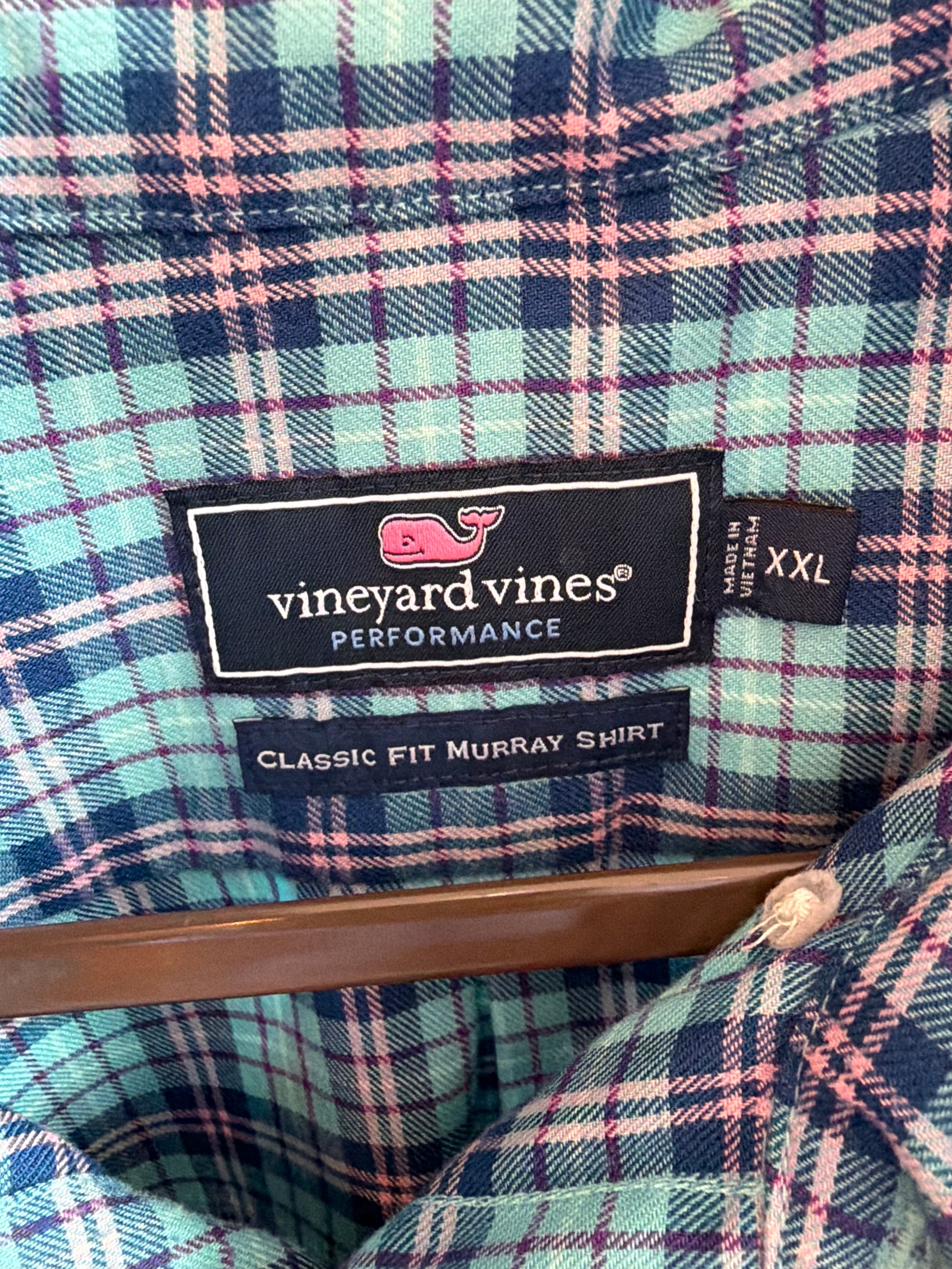 Upcycled blue plaid shirt with a ruffled collar, reworked one of a kind, at Dover Grace Boutique in Watkinsville, Georgia.