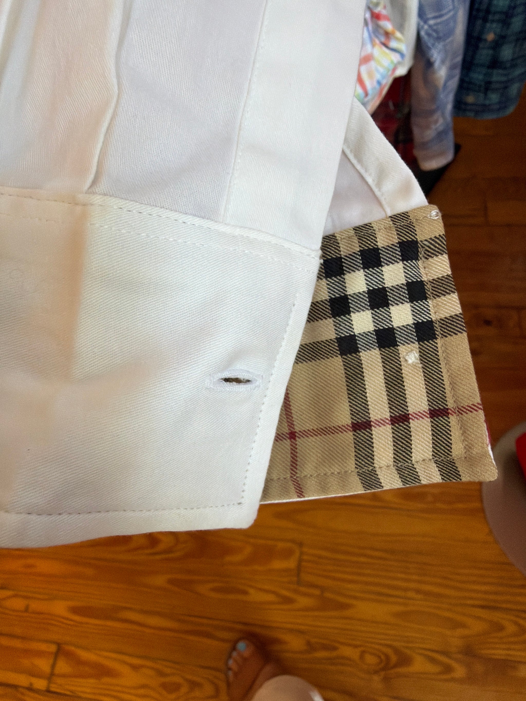 Upcycled white shirt with a tan and camel check ruffled collar and cuffs, reworked one of a kind, at Dover Grace Boutique in Watkinsville, Georgia.