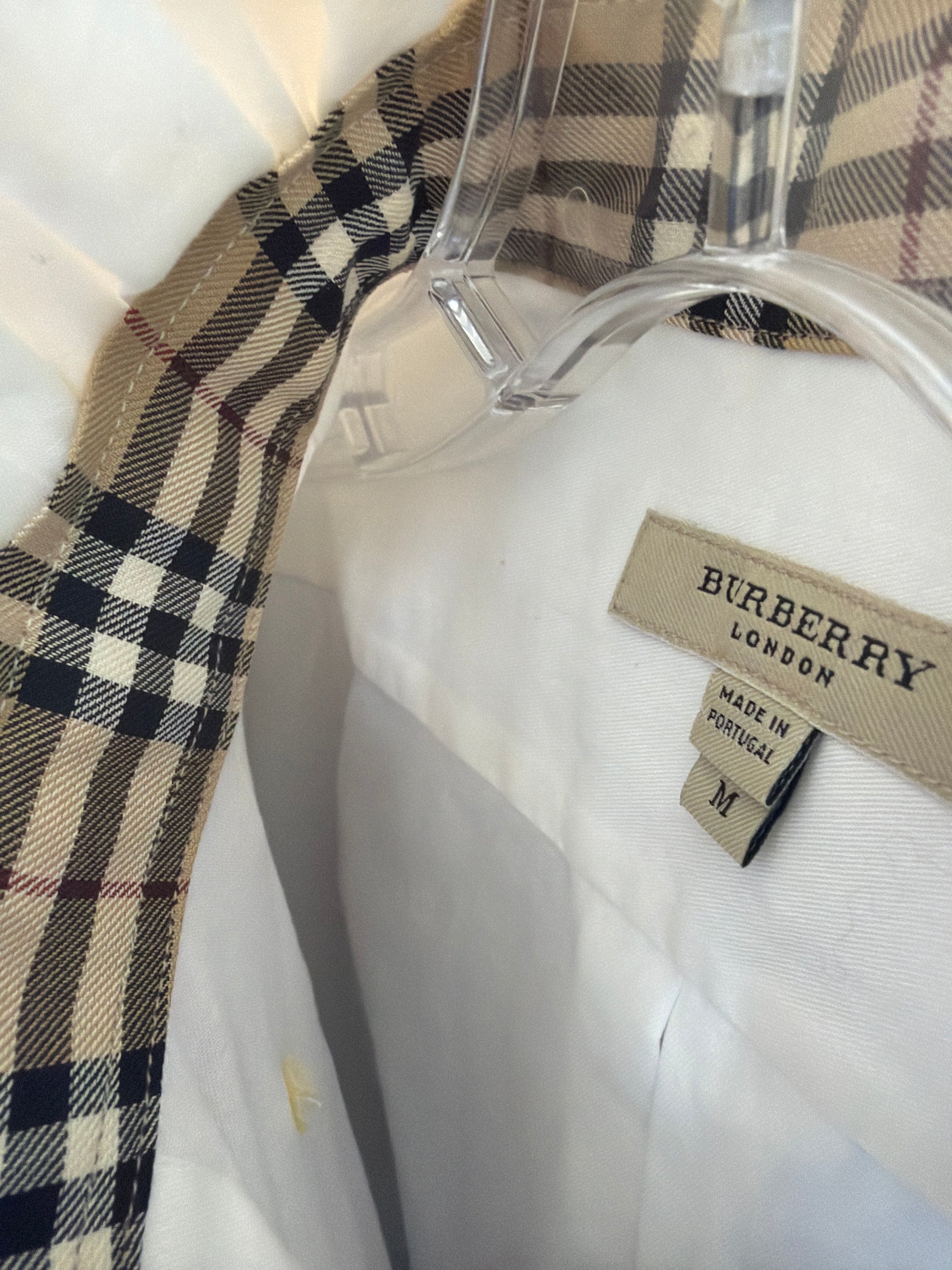 Upcycled white shirt with a tan and camel check ruffled collar and cuffs, reworked one of a kind, at Dover Grace Boutique in Watkinsville, Georgia.