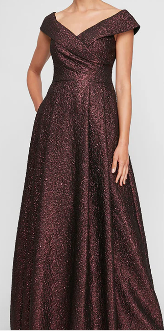 Front view of off-the-shoulder burgundy metallic jacquard A-line evening gown with V-neckline and cap sleeves