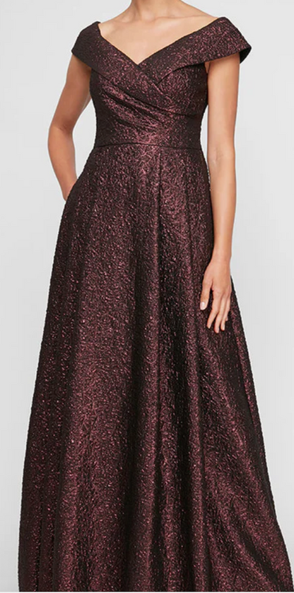 Front view of off-the-shoulder burgundy metallic jacquard A-line evening gown with V-neckline and cap sleeves