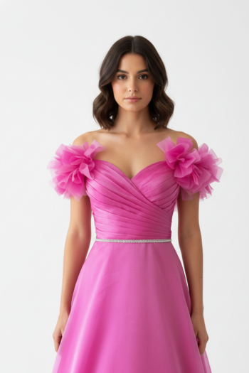 Floor-length vibrant pink ballgown featuring ruffled floral off-the-shoulder sleeves, a pleated sweetheart bodice with a thin rhinestone belt, and a full, shimmering organza skirt.