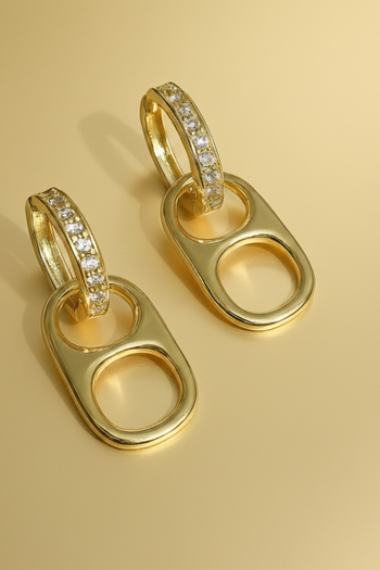 Gold-tone 35mm poptab huggie hoop earrings with small clear pave crystals along the front of the hoop.
