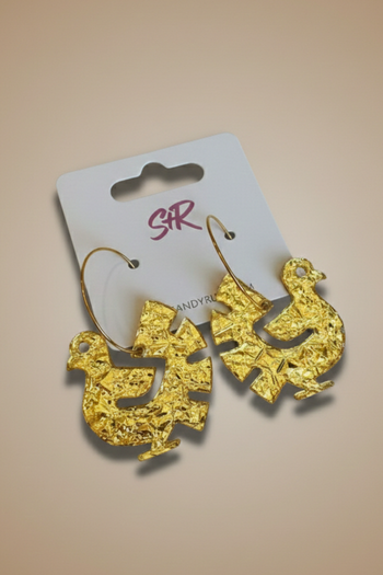 A pair of gold-toned hoop earrings featuring textured, crinkled gold foil charms shaped like stylized birds.