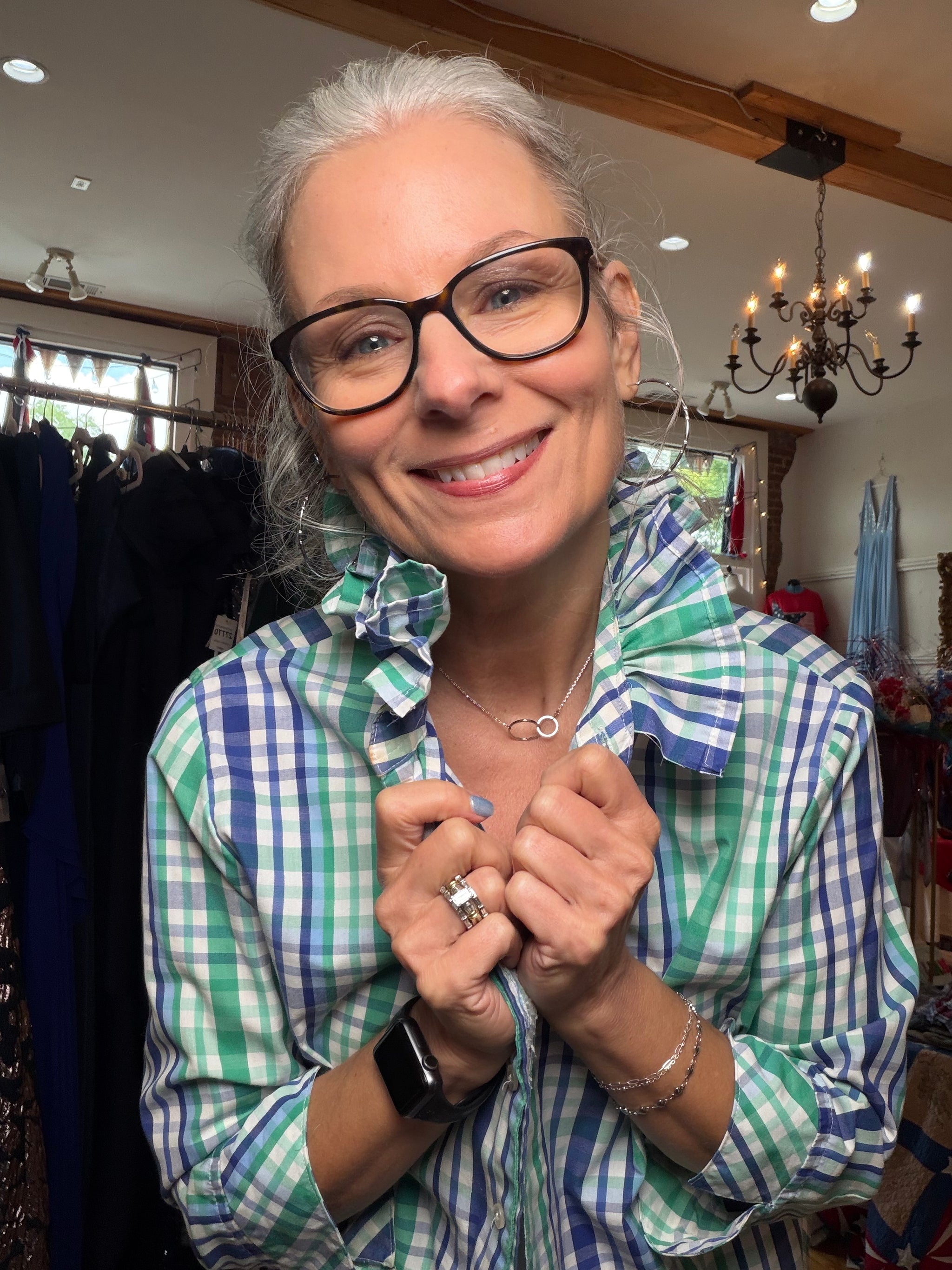 Reworked green and blue plaid shirt with a ruffled collar, a one of a kind upcycled piece from Dover Grace Boutique in Watkinsville, Georgia.