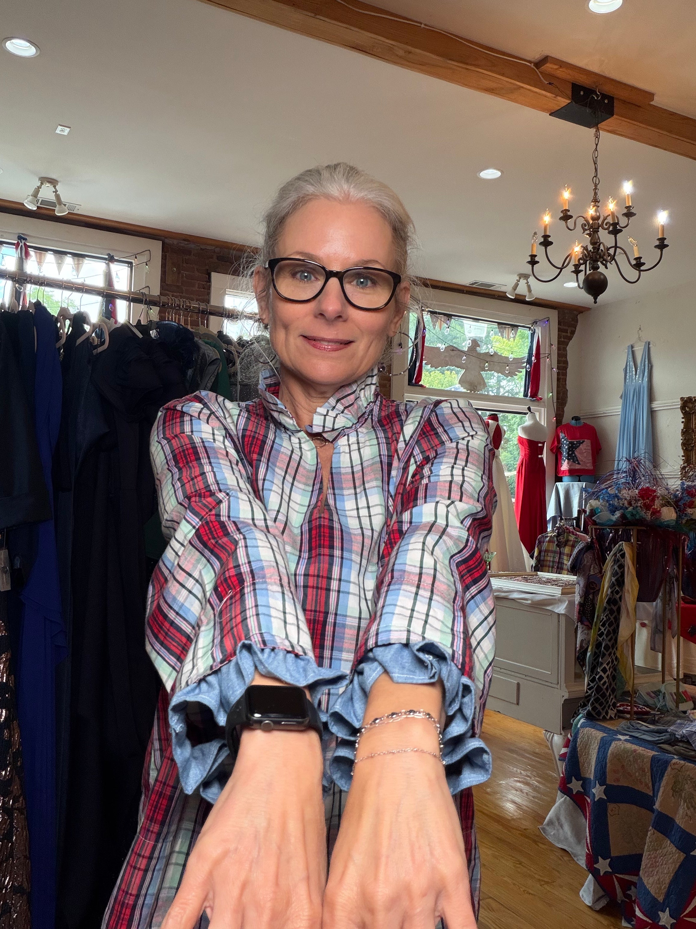 Reworked plaid button-down with dramatic ruffled sleeves, a one of a kind upcycled piece from Dover Grace Boutique in Watkinsville, Georgia.