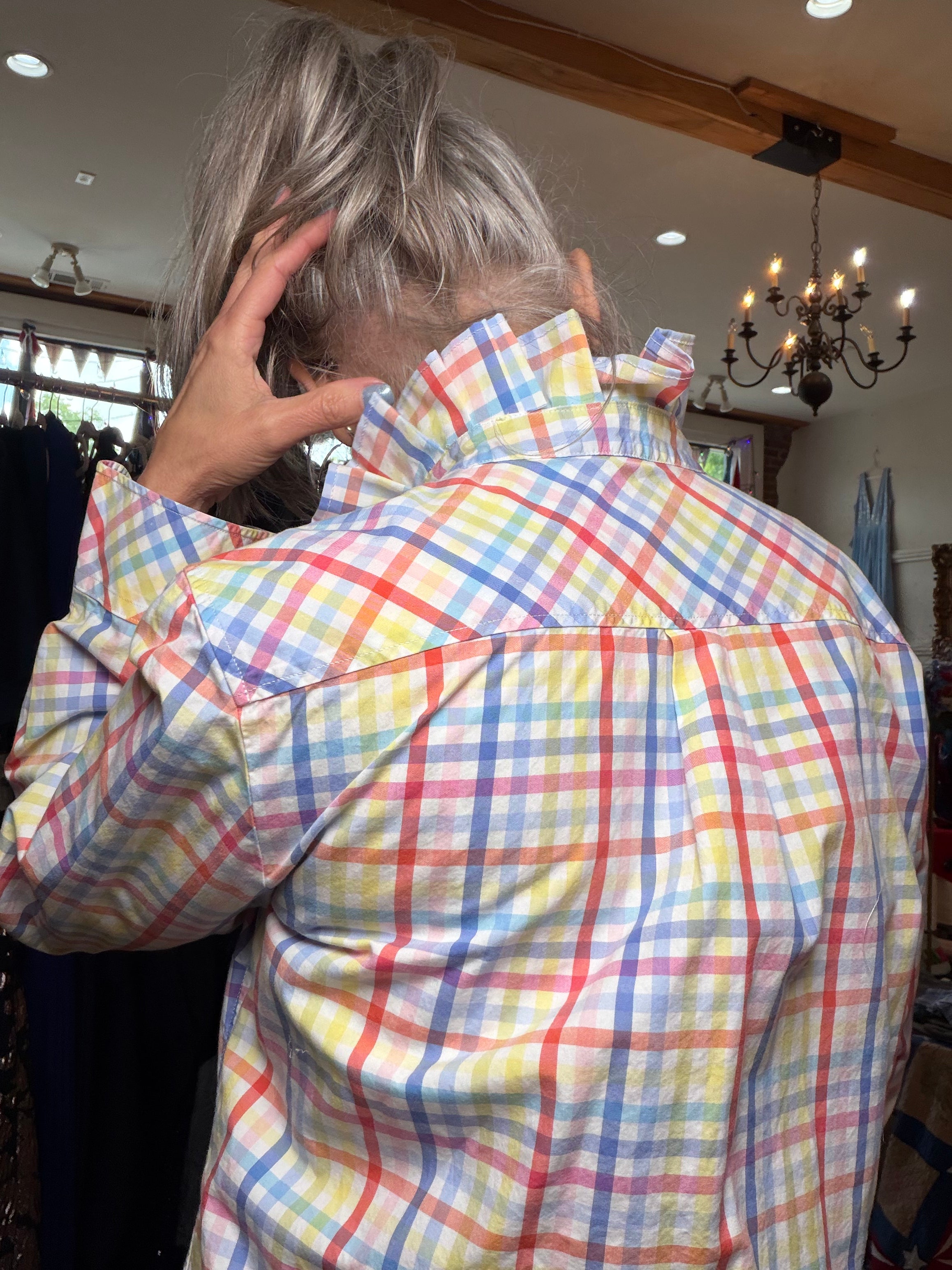 Upcycled bright multicolor check shirt with a ruffled collar, reworked one of a kind, at Dover Grace Boutique in Watkinsville, Georgia.
