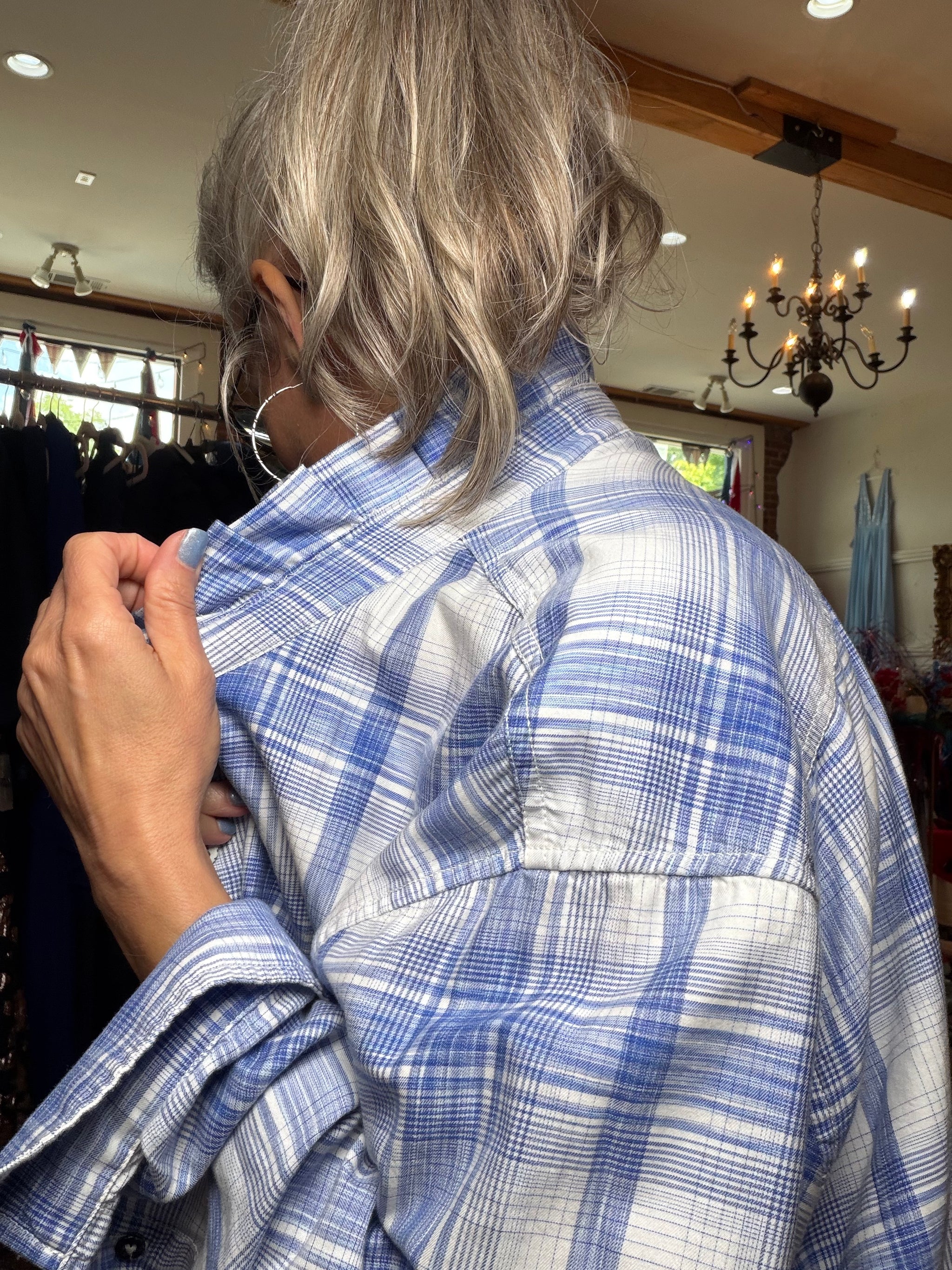 Reworked blue and white plaid button-down with a pleated ruffle collar, a one of a kind upcycled piece from Dover Grace Boutique in Watkinsville, Georgia.