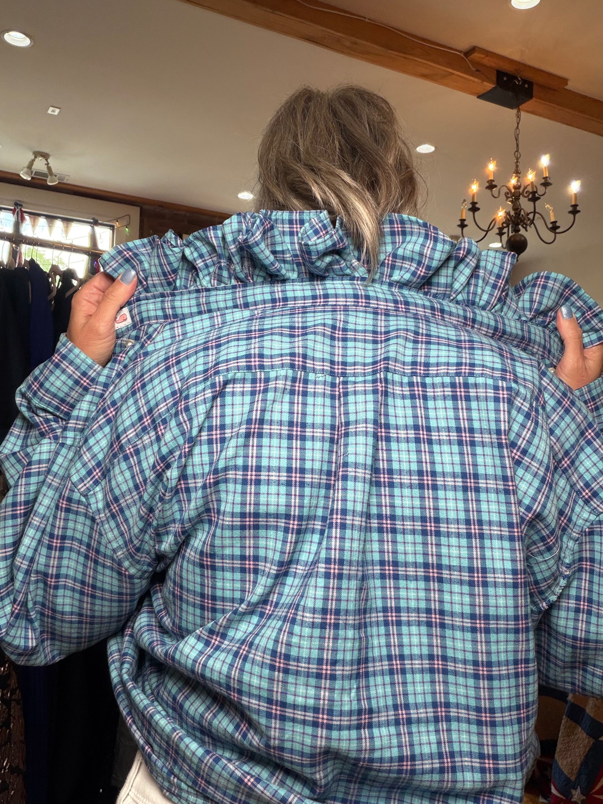 Upcycled blue plaid shirt with a ruffled collar, reworked one of a kind, at Dover Grace Boutique in Watkinsville, Georgia.