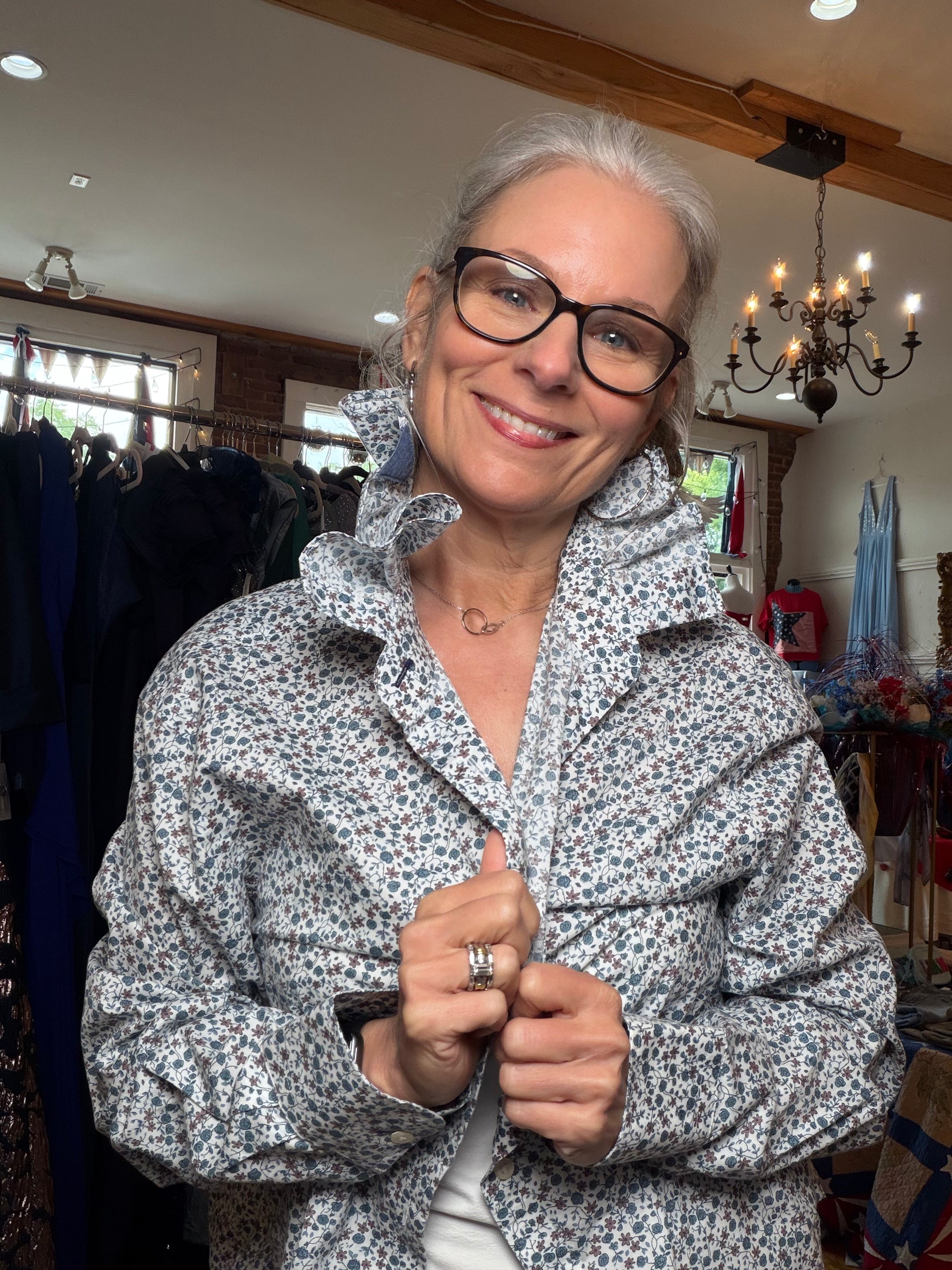 Upcycled white and blue floral shirt with a ruffled collar, reworked one of a kind, at Dover Grace Boutique in Watkinsville, Georgia.