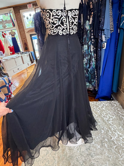 Timeless black and white vintage dress, a one of a kind curated piece from Dover Grace Boutique in Watkinsville, Georgia.