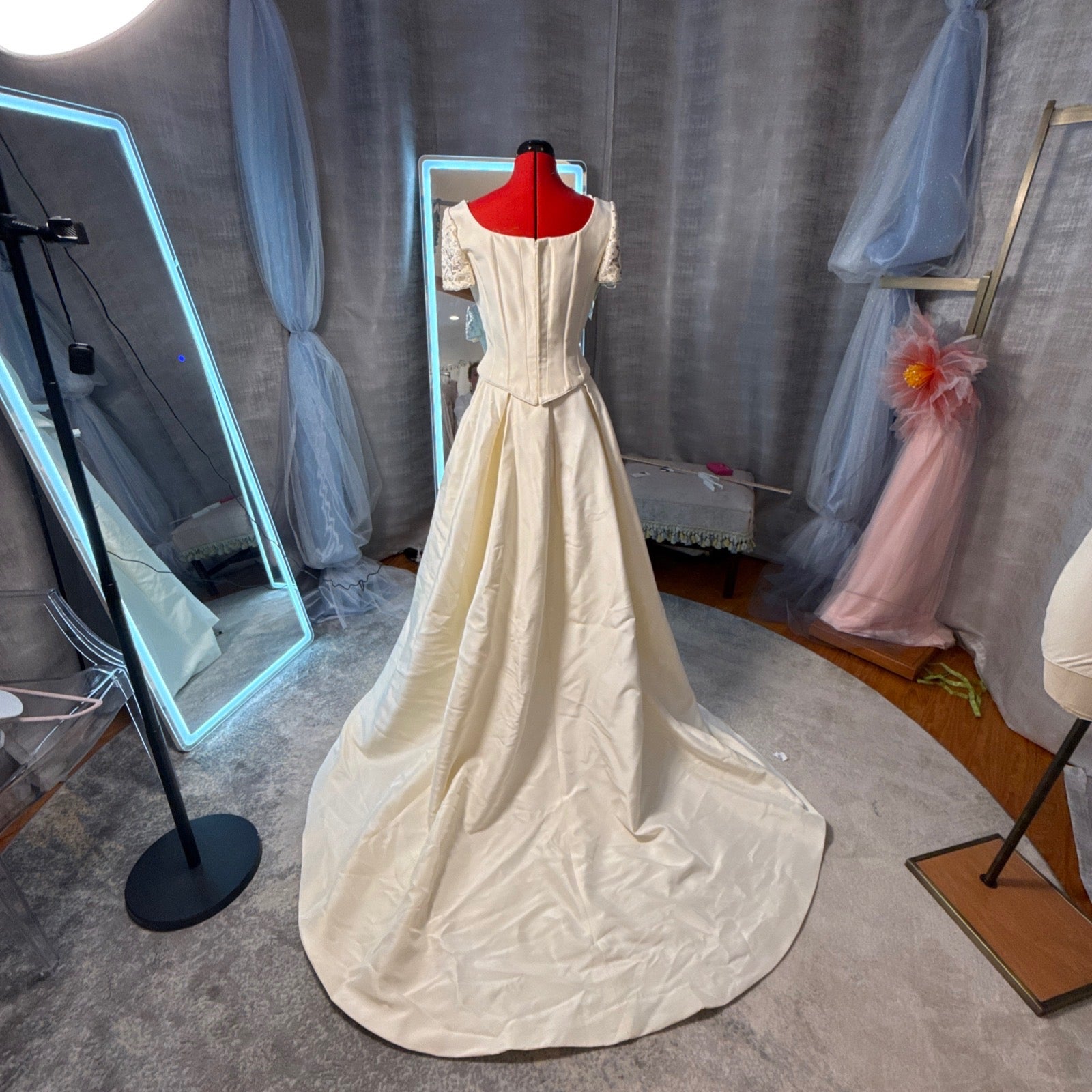Pronovias vintage 2-piece ivory mikado wedding gown, back view showing corset top with zipper closure, short lace sleeves, and full cathedral-length A-line train, size 14