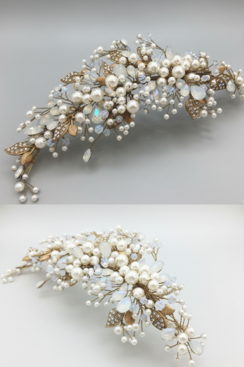 A luxurious bridal hair accessory featuring white pearls, opal crystals, and gold-toned jeweled leaves, displayed against a minimalist white background.