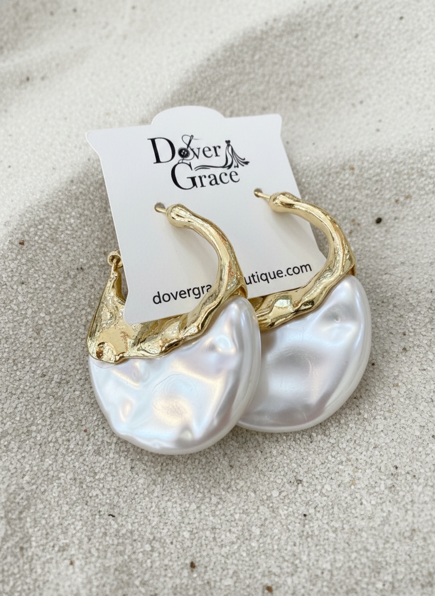Teardrop hoop earrings with a textured molten gold-tone upper half and a sculpted iridescent pearl lower half.