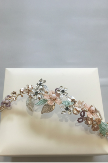Floral tiara with pastel colors on a white box