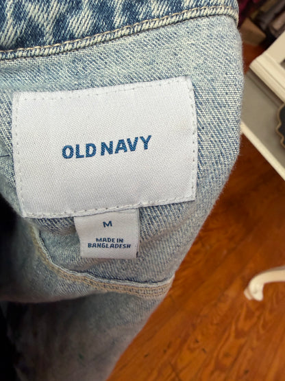 Old Navy label and size M tag inside the light wash denim jacket.