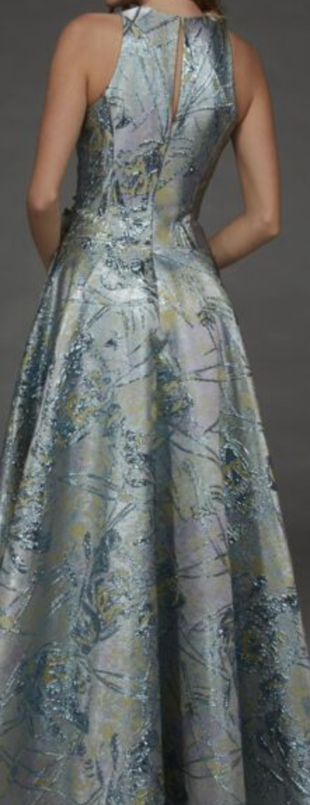 Back view of a sea glass and gold brocade gown with a keyhole back and A-line skirt.