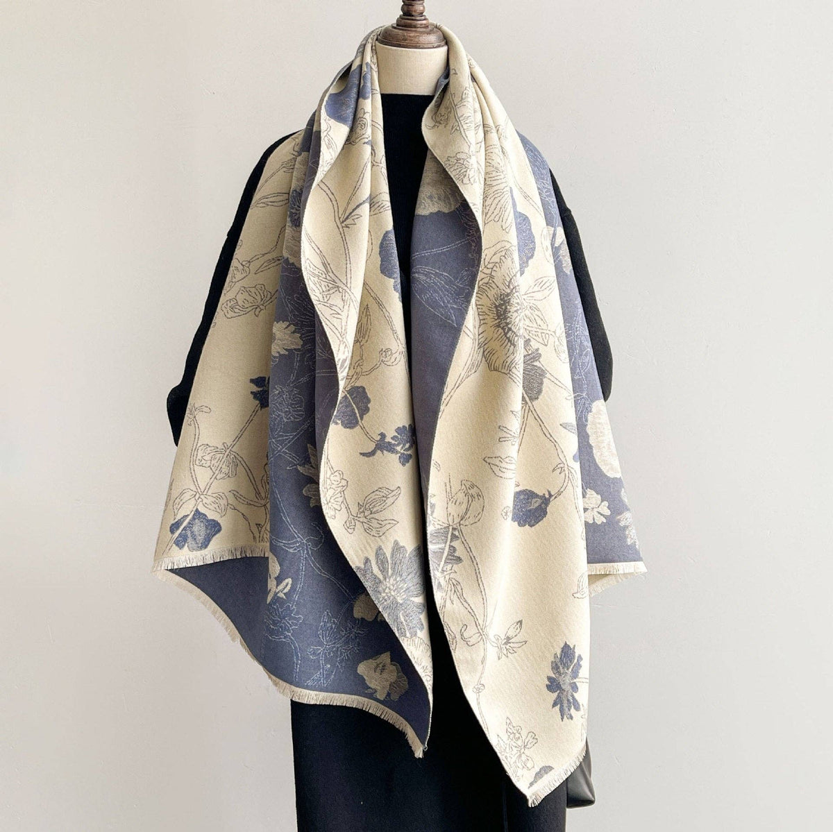 Blue and cream reversible scarf on mannequin at Dover Grace Boutique in Watkinsville, Georgia.