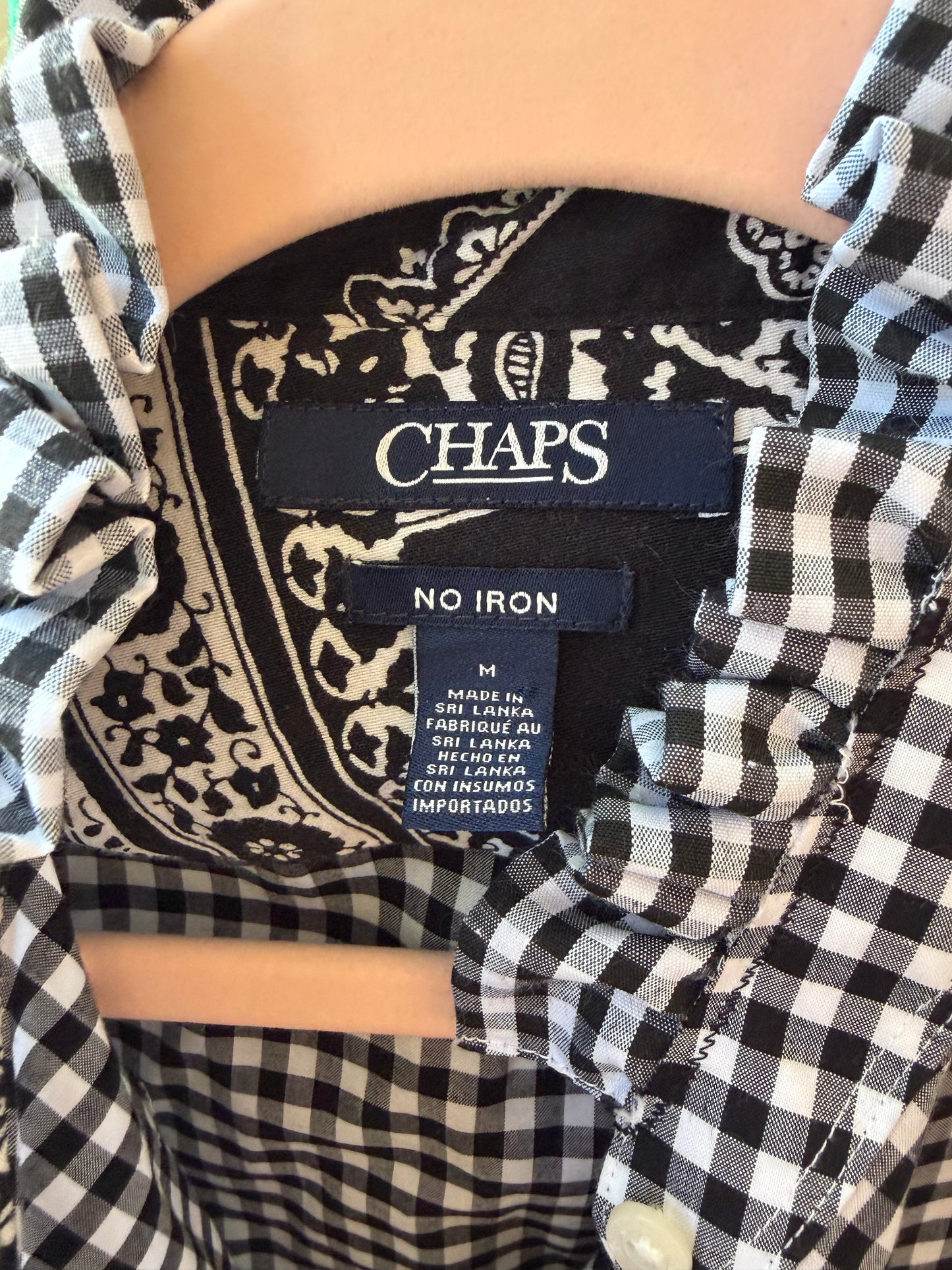 Chaps size M label inside a gingham shirt with bandana-print inner yoke and ruffled collar.