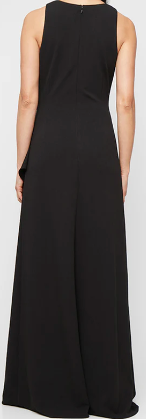 Black sleeveless stretch crepe gown with beaded hip and ruffle skirt at Dover Grace Boutique in Watkinsville, Georgia.