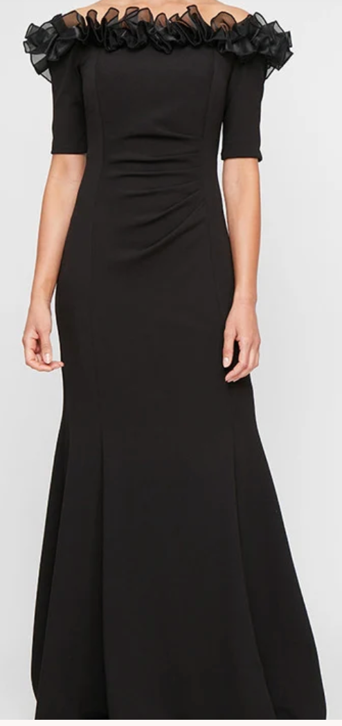 Black off-shoulder stretch crepe gown with organza ruffle neckline at Dover Grace Boutique in Watkinsville, Georgia.