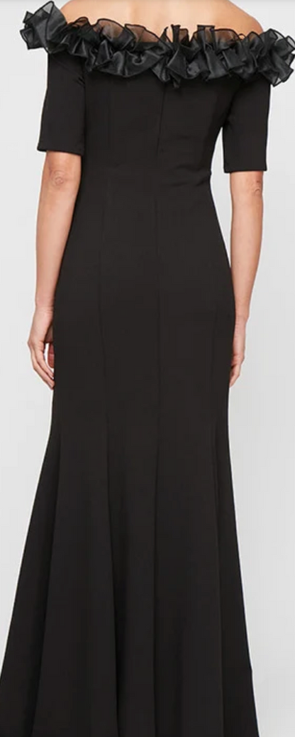 Black off-shoulder stretch crepe gown with organza ruffle neckline at Dover Grace Boutique in Watkinsville, Georgia.
