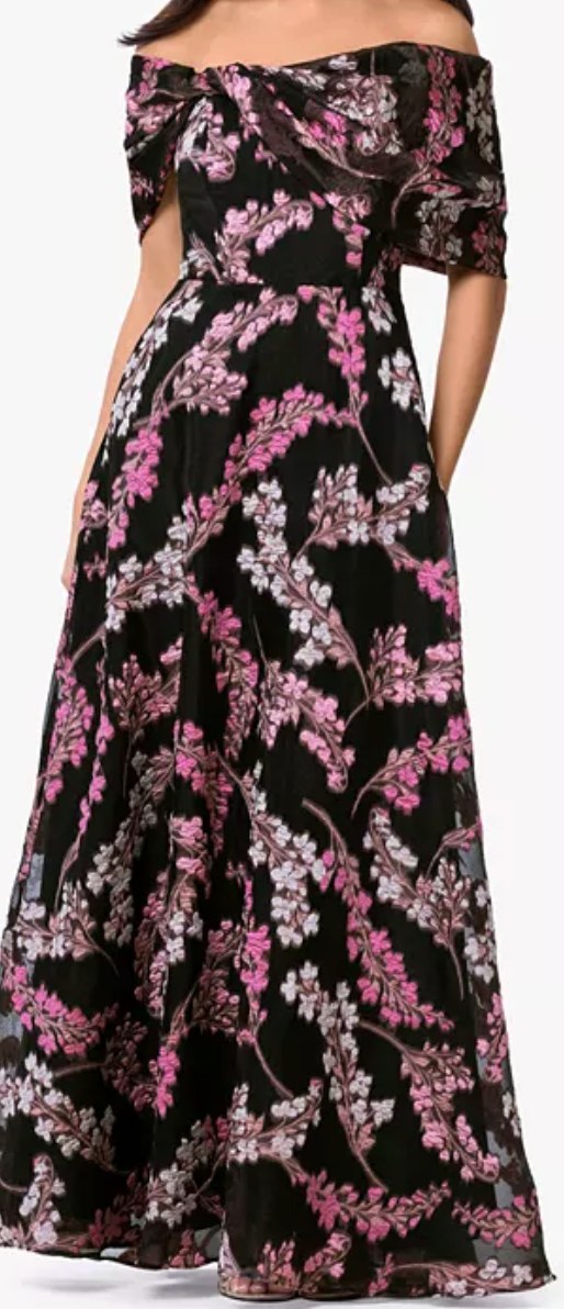 Floral organza brocade off-shoulder gown with pockets at Dover Grace Boutique in Watkinsville, Georgia.