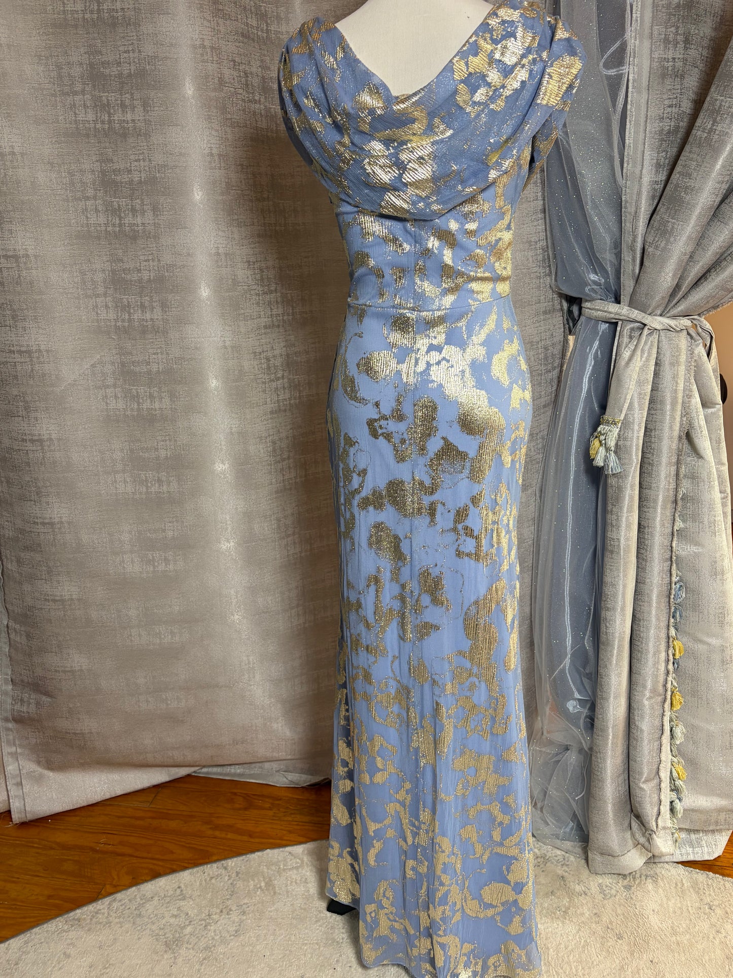 Light blue and gold metallic draped evening gown at Dover Grace Boutique in Watkinsville, Georgia.