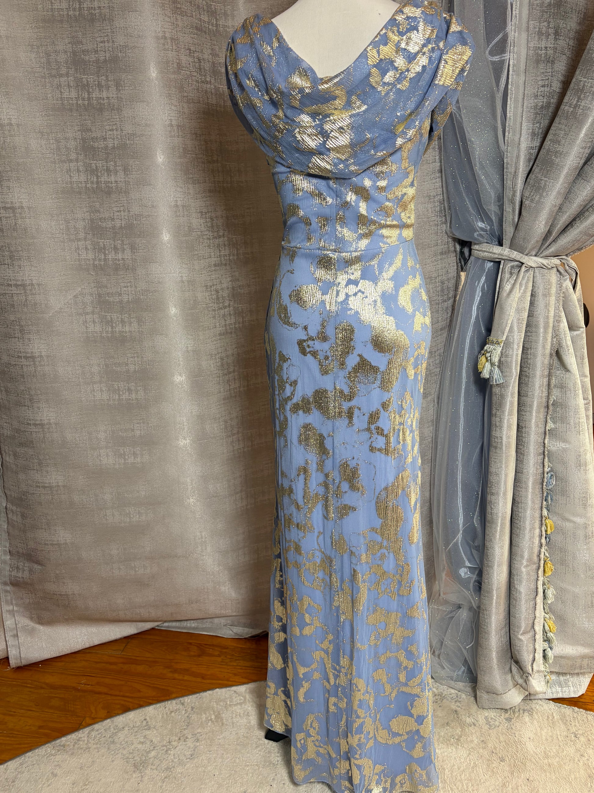 Light blue and gold metallic draped evening gown at Dover Grace Boutique in Watkinsville, Georgia.