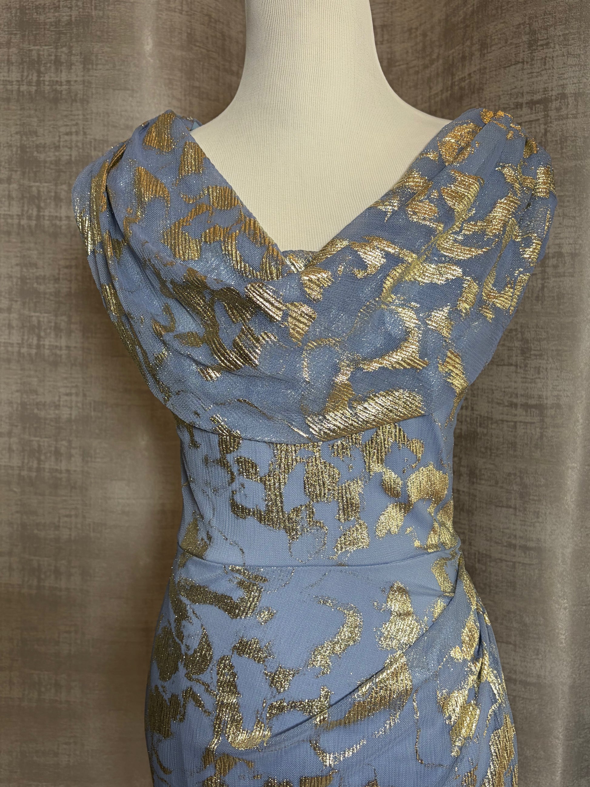 Light blue and gold metallic draped evening gown at Dover Grace Boutique in Watkinsville, Georgia.