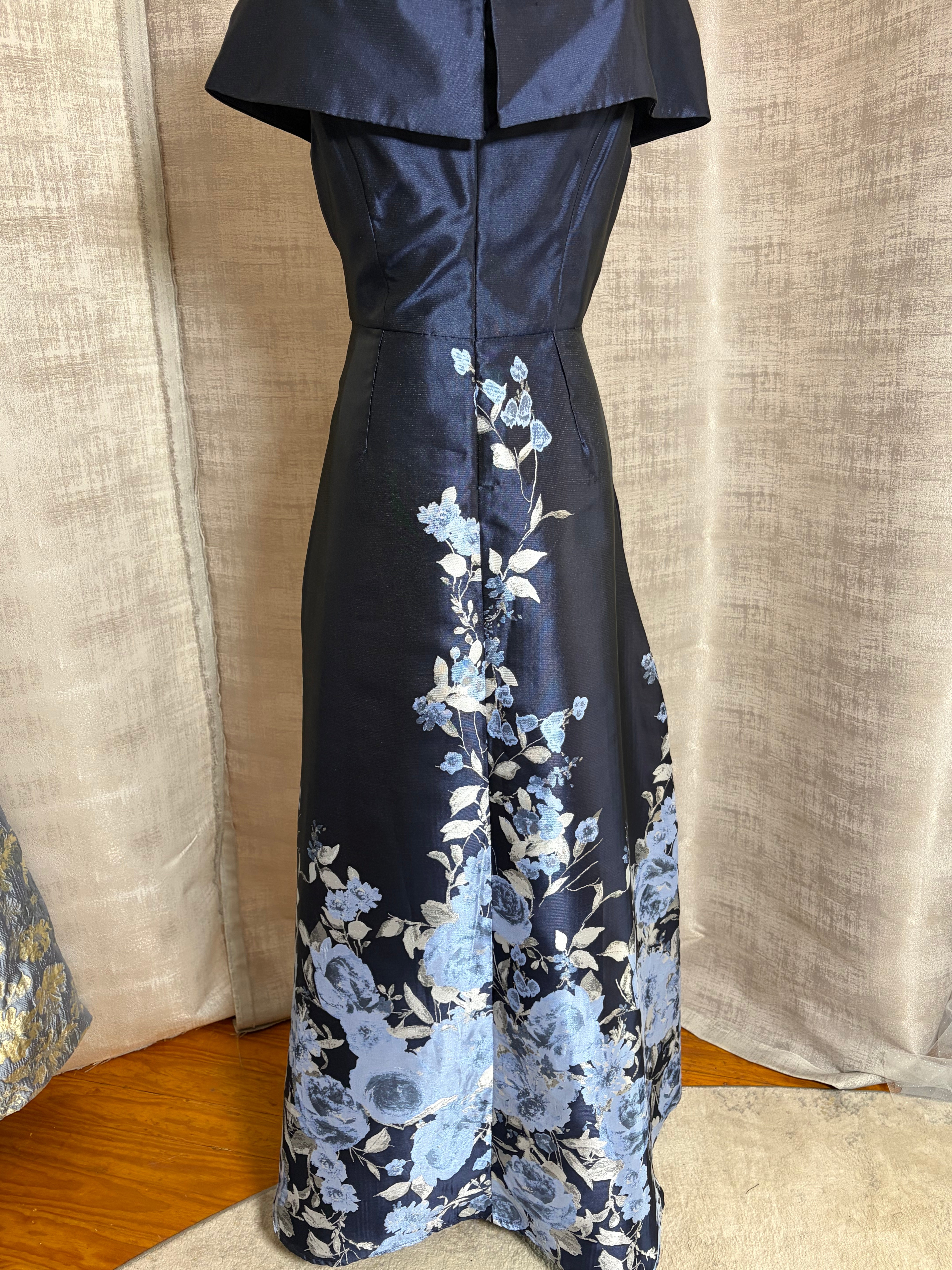 Navy floral off-shoulder A-line evening gown with V-neckline at Dover Grace Boutique in Watkinsville, Georgia.