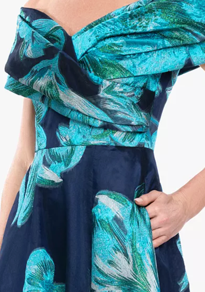 Navy and teal floral jacquard off-shoulder evening gown at Dover Grace Boutique in Watkinsville, Georgia.