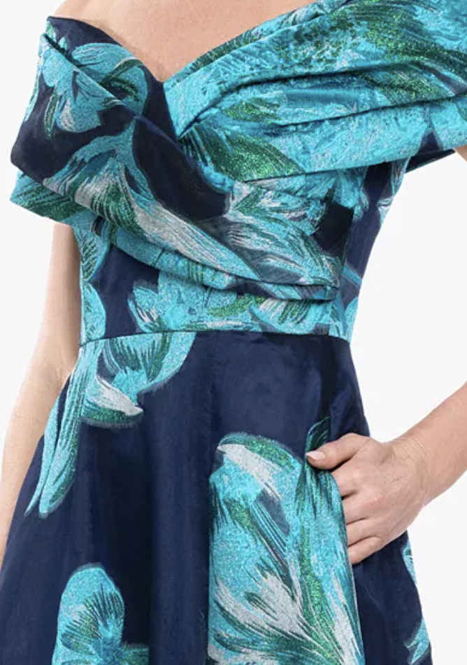 Navy and teal floral jacquard off-shoulder evening gown at Dover Grace Boutique in Watkinsville, Georgia.