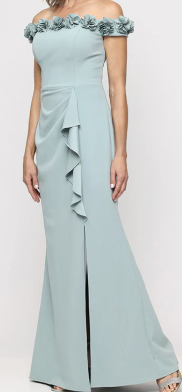 Sage green off-shoulder gown with 3D flower neckline at Dover Grace Boutique in Watkinsville, Georgia.