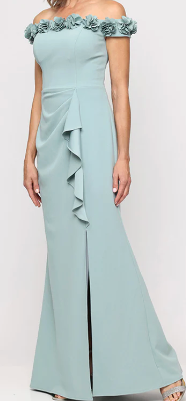 Sage green off-shoulder gown with 3D flower neckline at Dover Grace Boutique in Watkinsville, Georgia.