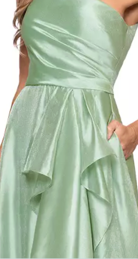 Sage green one-shoulder organza A-line evening gown at Dover Grace Boutique in Watkinsville, Georgia.