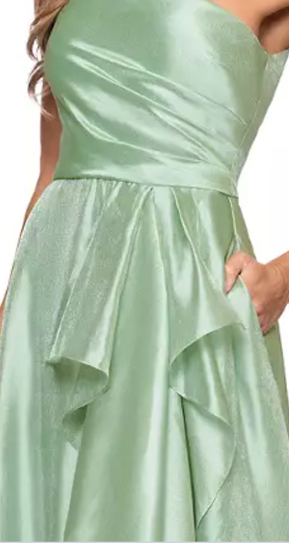 Sage green one-shoulder organza A-line evening gown at Dover Grace Boutique in Watkinsville, Georgia.