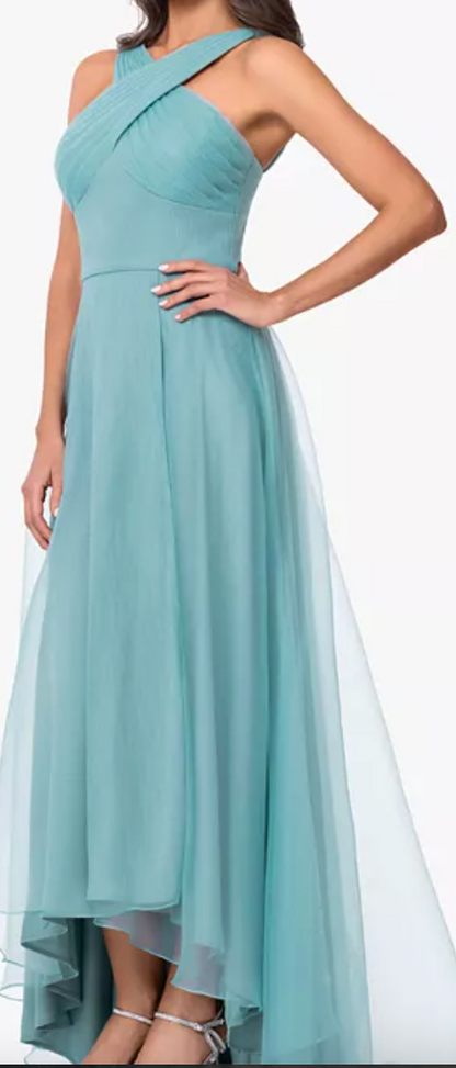 Seafoam tulle high-low gown with crisscross neckline at Dover Grace Boutique in Watkinsville, Georgia.