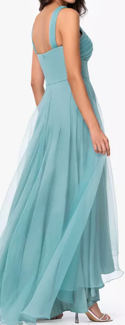 Seafoam tulle high-low gown with crisscross neckline at Dover Grace Boutique in Watkinsville, Georgia.