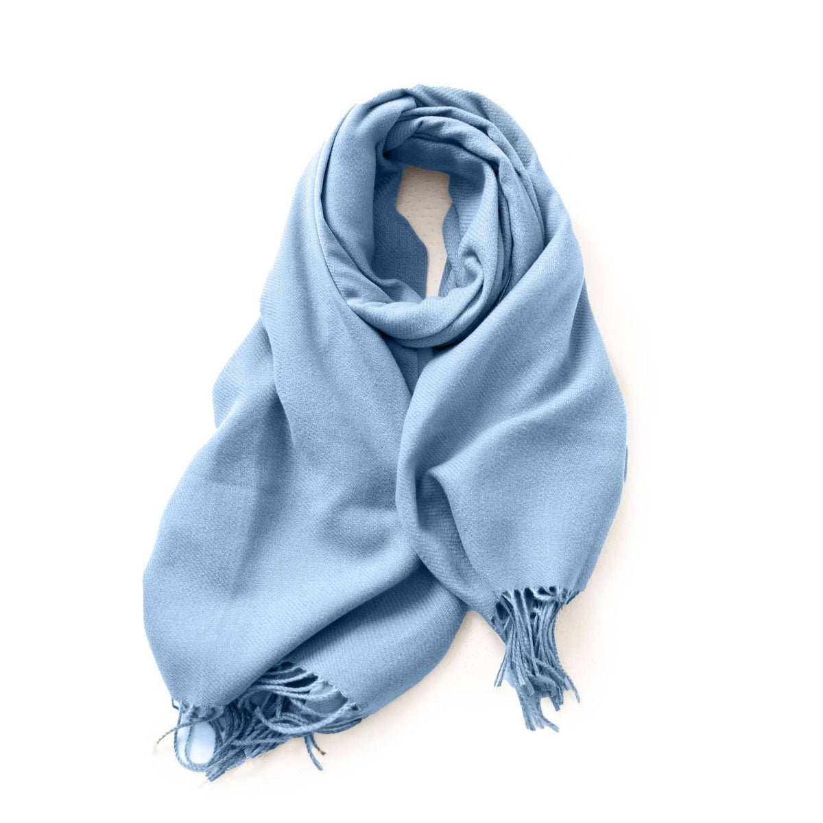 Light blue fringed faux-cashmere scarf on white at Dover Grace Boutique in Watkinsville, Georgia.