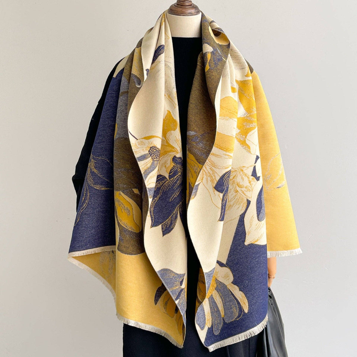 Navy and yellow floral scarf on mannequin at Dover Grace Boutique in Watkinsville, Georgia.