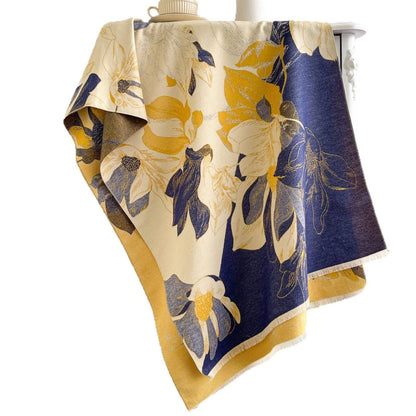 Navy and yellow floral scarf on white backdrop at Dover Grace Boutique in Watkinsville, Georgia.