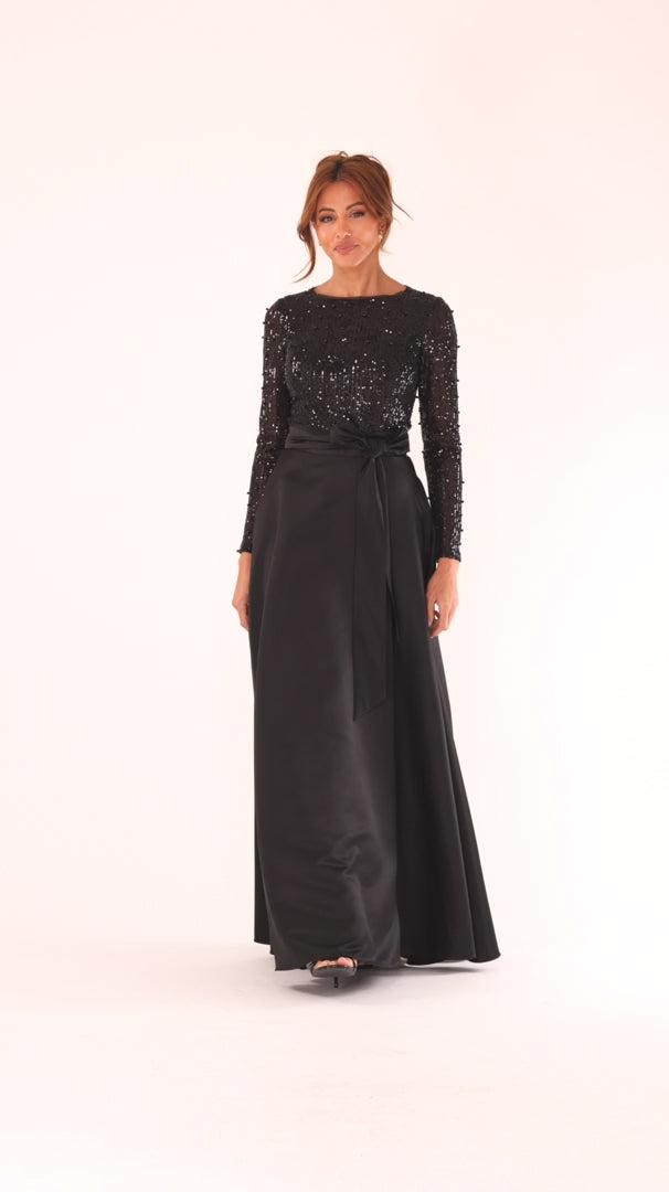 Model wearing black sequin bodice satin ballgown at Dover Grace Boutique in Watkinsville, Georgia.