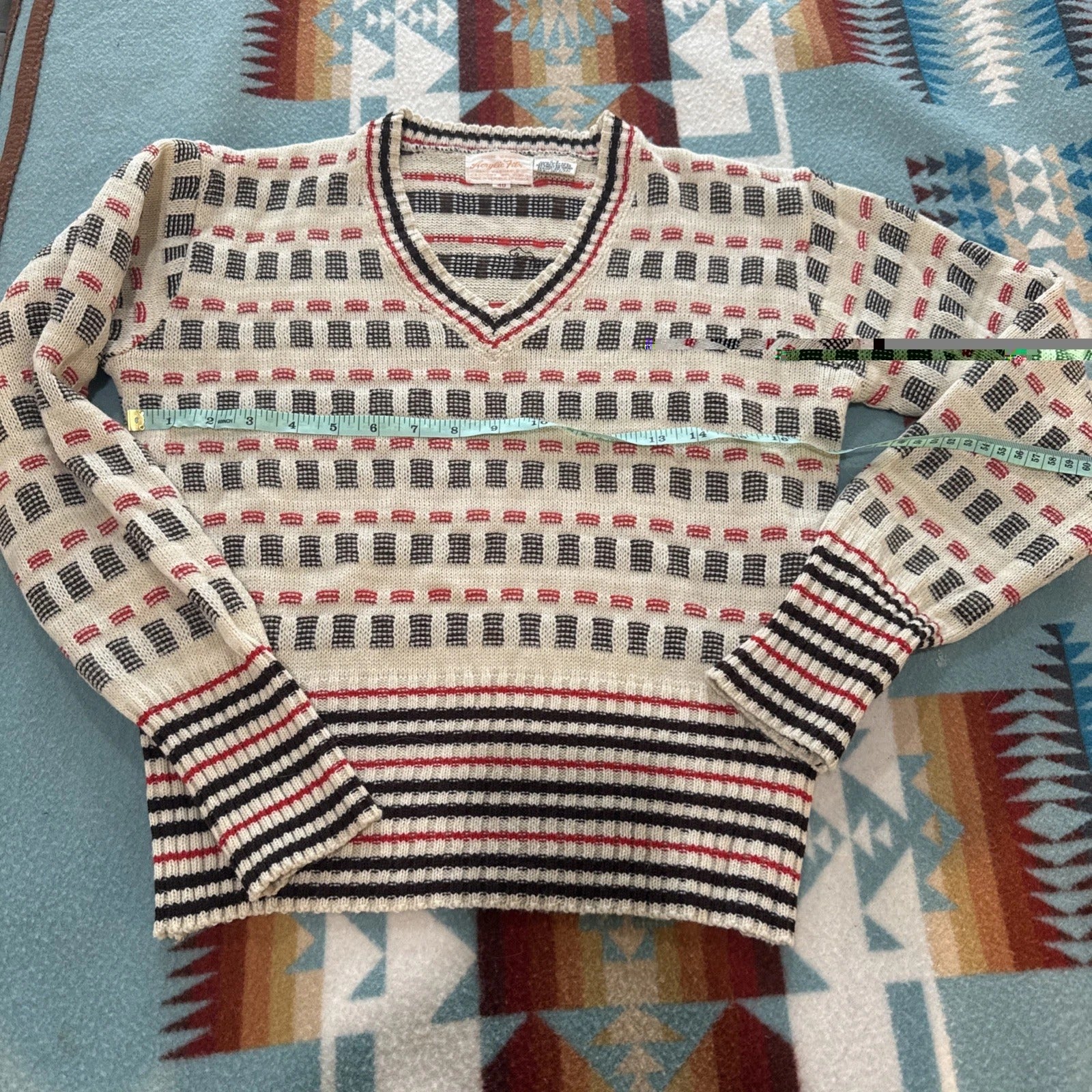 Striped sweater on a patterned fabric background