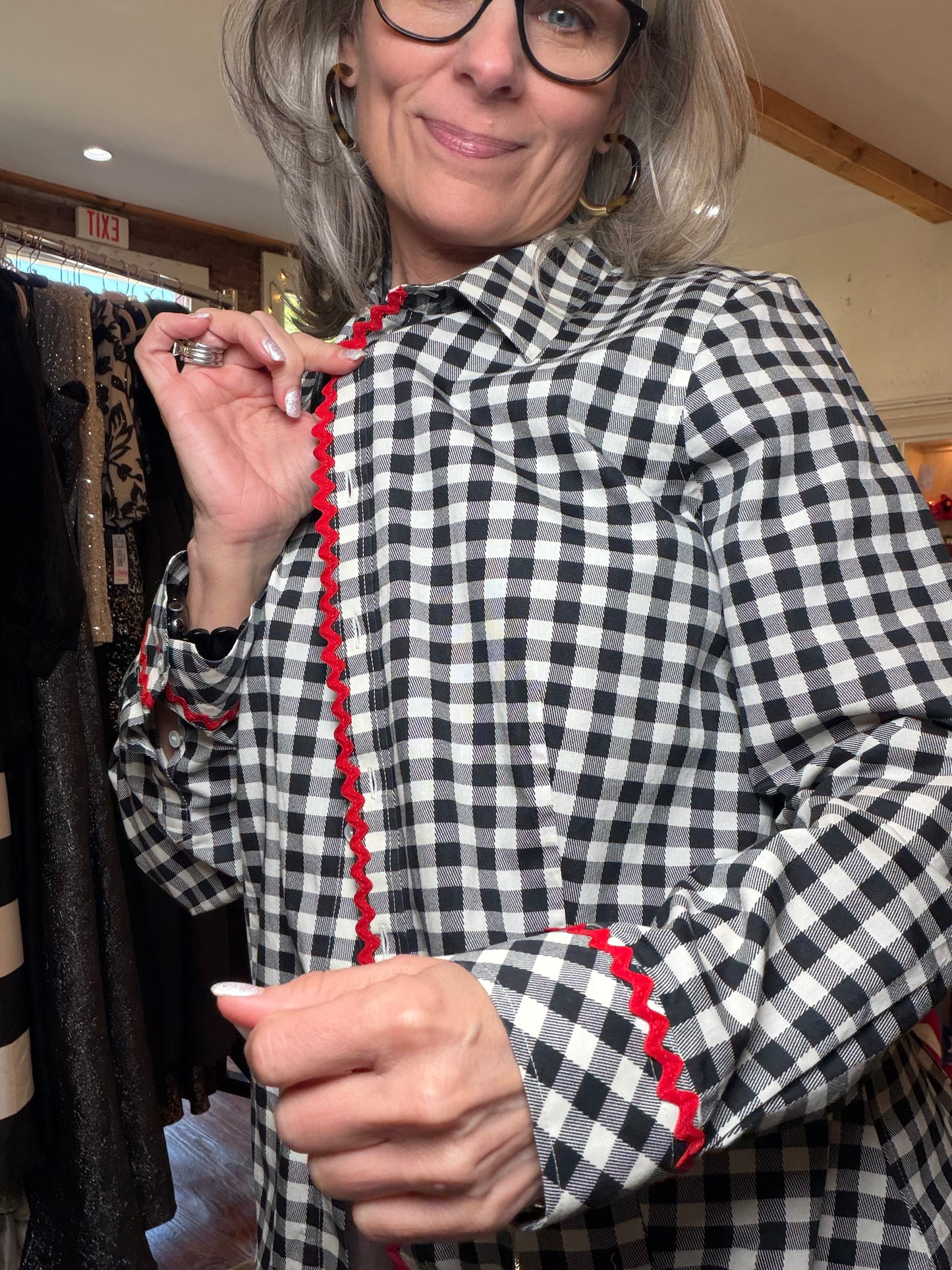 Black and white gingham shirt showing the pointed collar and red rickrack front trim.