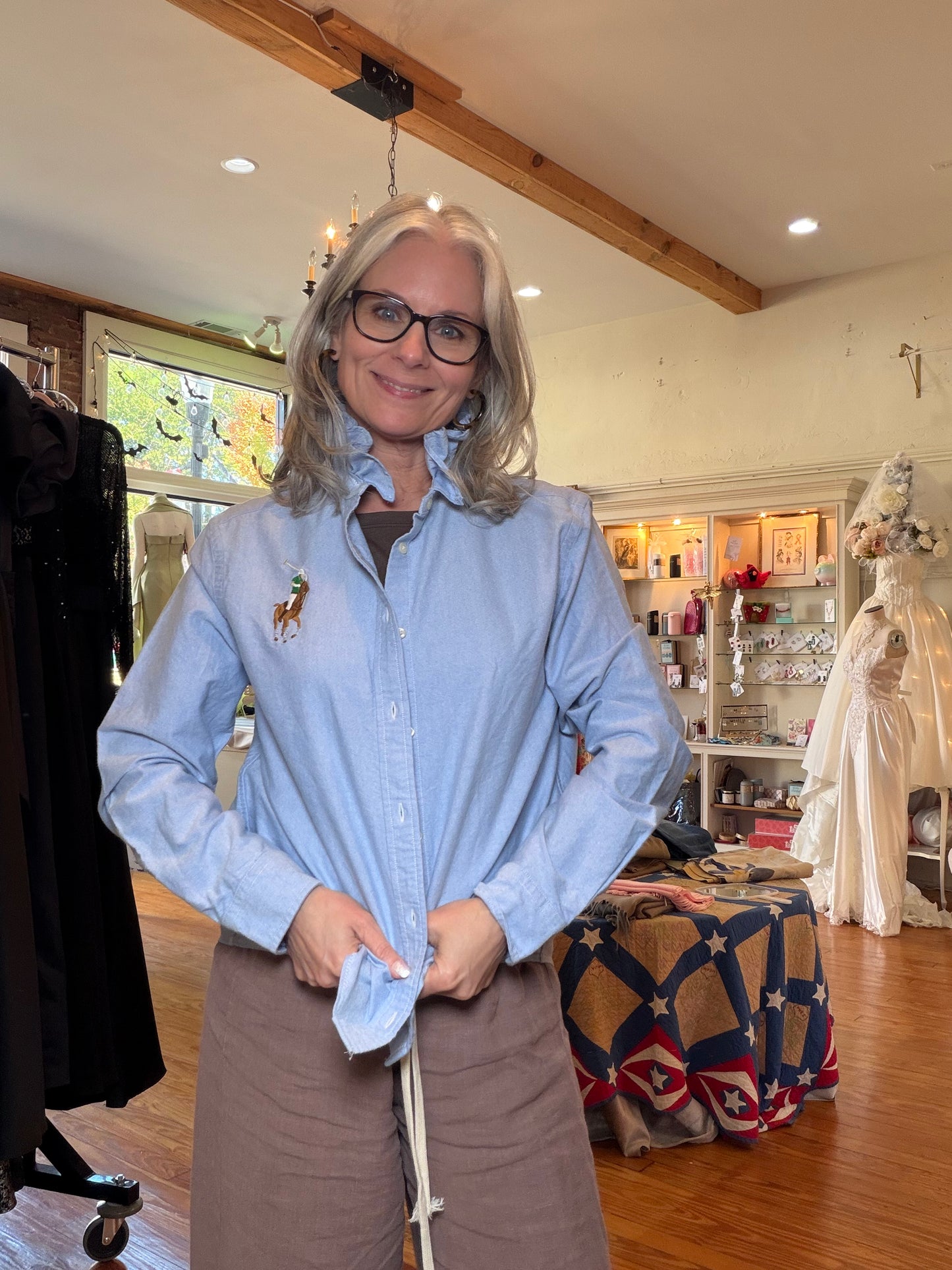 Front view of the upcycled Ralph Lauren blue oxford shirt with long sleeves and a ruffled collar