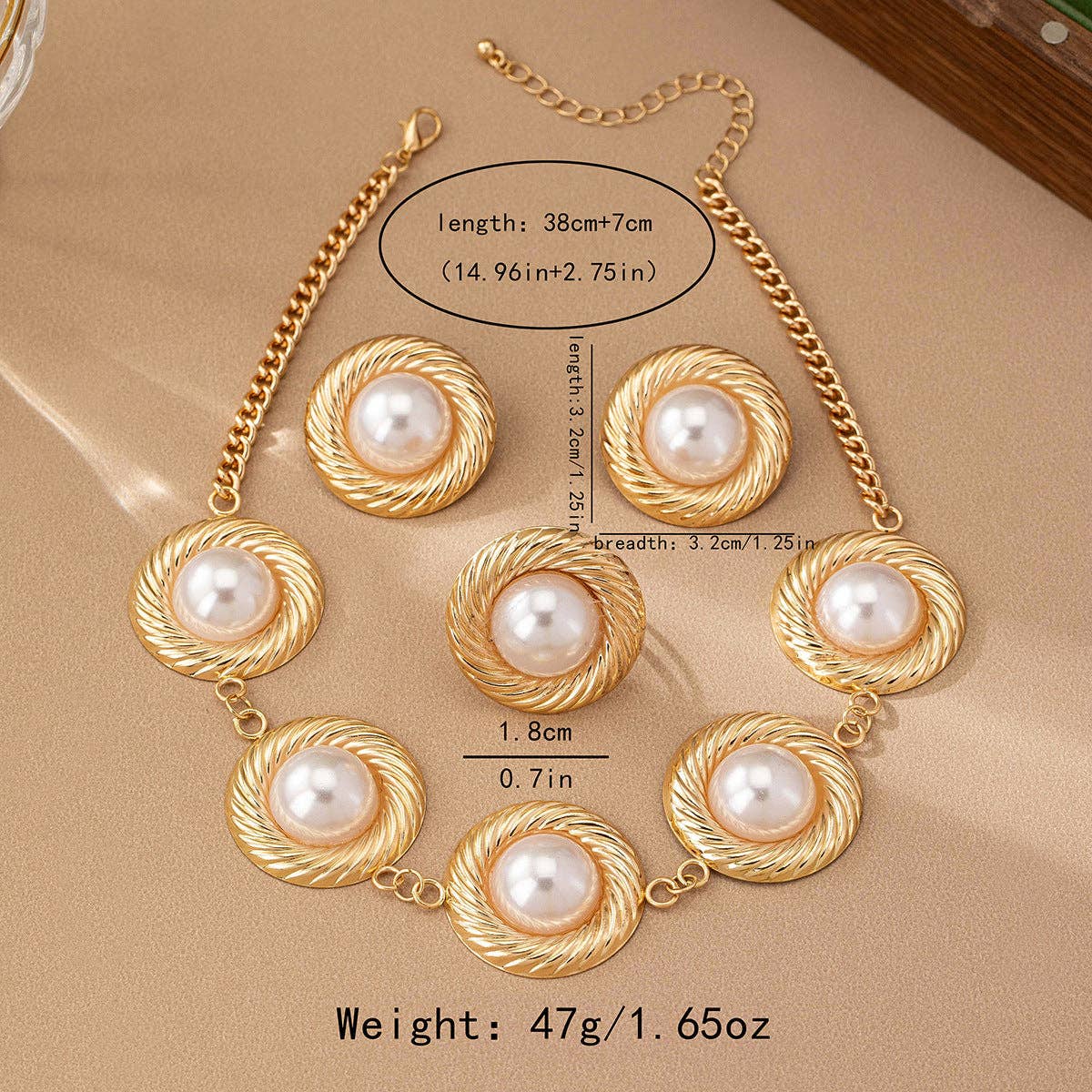 White pearl necklace flat lay on beige backdrop at Dover Grace Boutique in Watkinsville, Georgia.